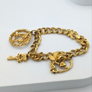 Vintage signed renoir gold tone charm chain bracelet